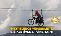 Metrelerce yükseklikte bisikletiyle Zipline yaptı